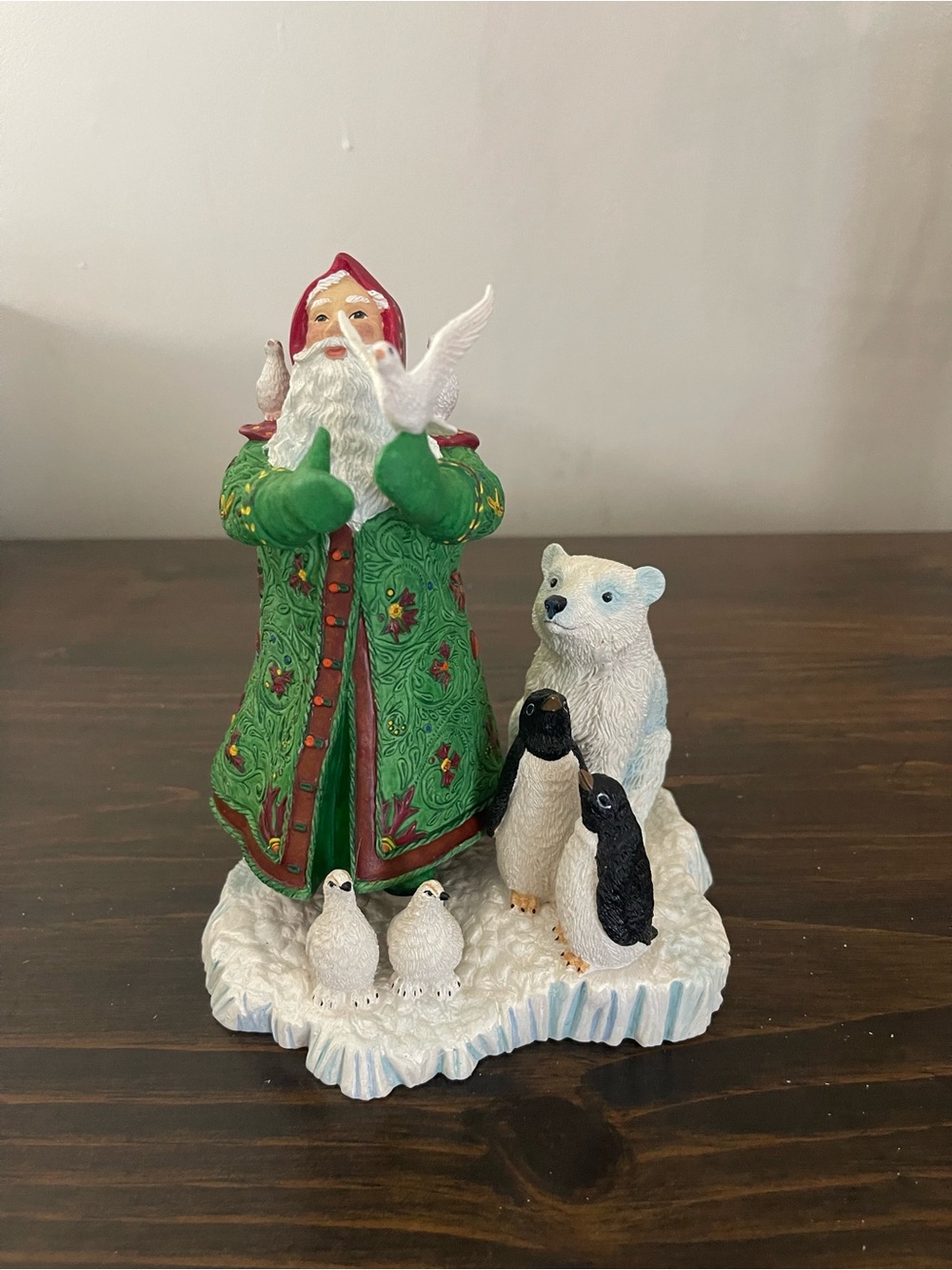 This is a 1996 Lenox figurine titled "Santa's Gift of Peace," designed by Lynn B